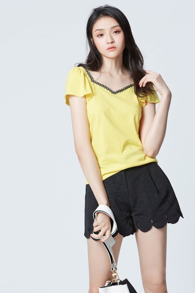 Bright yellow top with puff sleeves