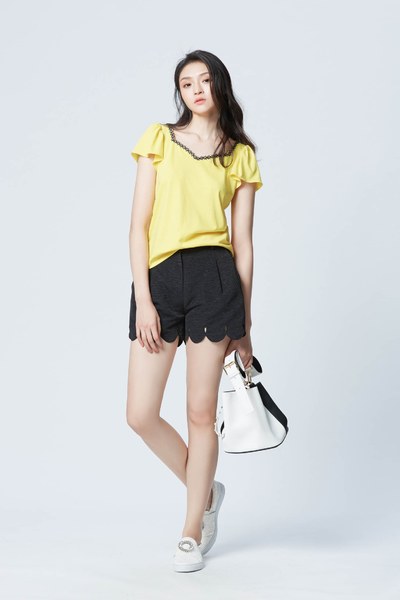 Bright yellow top with puff sleeves