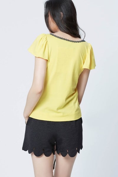 Bright yellow top with puff sleeves