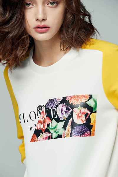 iROO x Flower in Vogue color spliced long sleeves with irregular cutting design